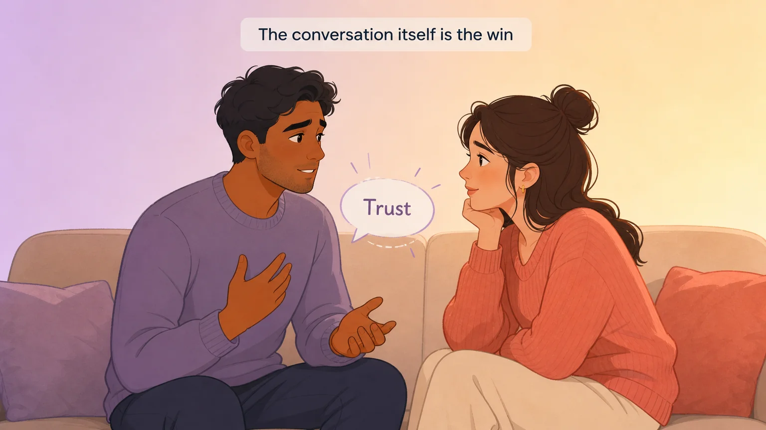 A couple having a gentle, vulnerable conversation on the couch — bringing up a private desire with trust