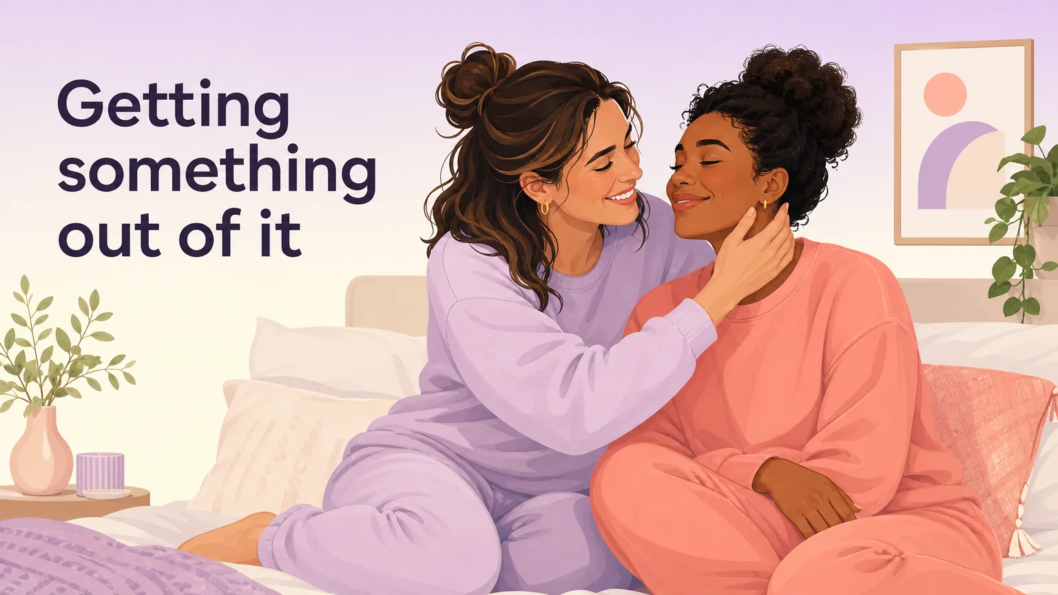 Two women close together on a bed, one giving her partner her full attention